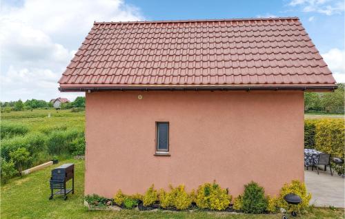 a small house with a red roof at Lovely Home In Zastan With Wifi in Zastań