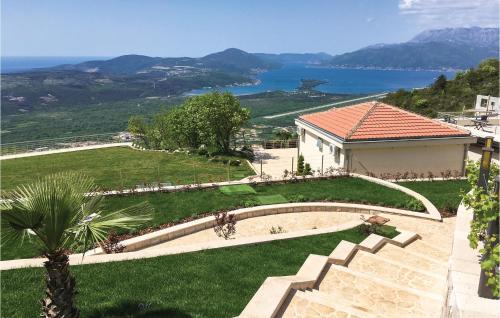 a house with a garden and a view of the water at Nice Home In Kotor With Sauna in Kotor