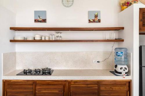 a kitchen with a stove and a counter top at Stylish villa, Ubud, 2 bed,2 bath, central location, pool, private! in Ubud