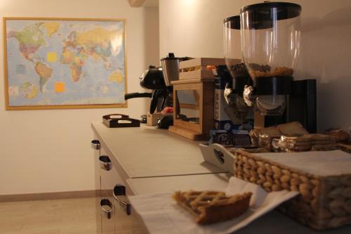 a kitchen with a counter with a world map on the wall at Sesta Strada in Civitavecchia