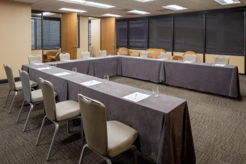 a large meeting room with a long table and chairs at Hyatt House New Orleans Downtown in New Orleans