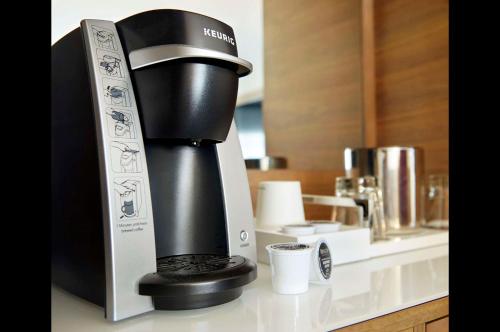 a coffee maker is sitting on a counter at Cambria Hotel Phoenix Chandler - Fashion Center in Chandler