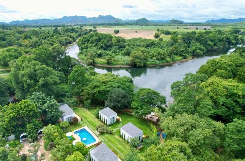 an aerial view of a house next to a river at Rakmak Kan Resort & Cafe in Ban Wang Dong
