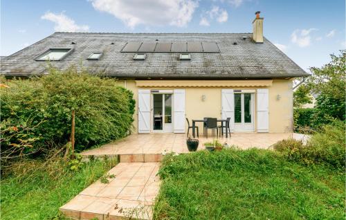 a house with solar panels on the roof at Gorgeous Home In Joué Les Tours in Joue-les-Tours