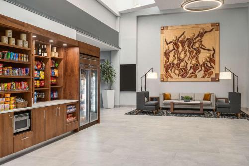 a pharmacy lobby with a waiting room with a couch at Doubletree by Hilton Fort Myers at Bell Tower Shops in Fort Myers
