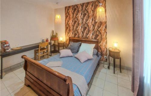 a bedroom with a bed with two pillows on it at Nice Home In Bucquoy With Wifi in Bucquoy