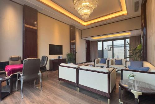 TV o dispositivi per l'intrattenimento presso Wyndham Grand Tongren Downtown Hotel
