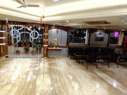 a dining room with tables and chairs and a ceiling at Chandra Inn in Jodhpur