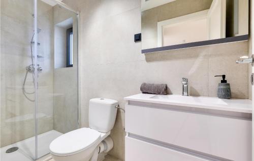a bathroom with a toilet and a sink and a shower at Beautiful Home In Stubicke Toplice in Stubicke Toplice