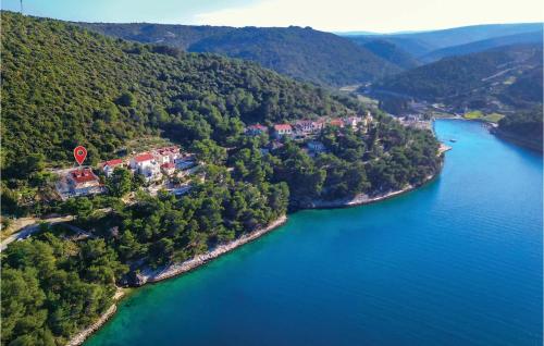 an island in the middle of a body of water at Lovely Home In Pucisca With Jacuzzi in Pučišća