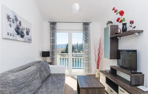 TV a/nebo společenská místnost v ubytování Apartment Blace With Sea View Xiii