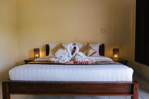 Katil atau katil-katil dalam bilik di New Starlight Hotel Lovina