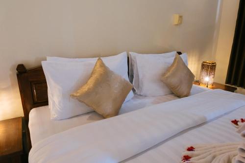 Katil atau katil-katil dalam bilik di New Starlight Hotel Lovina