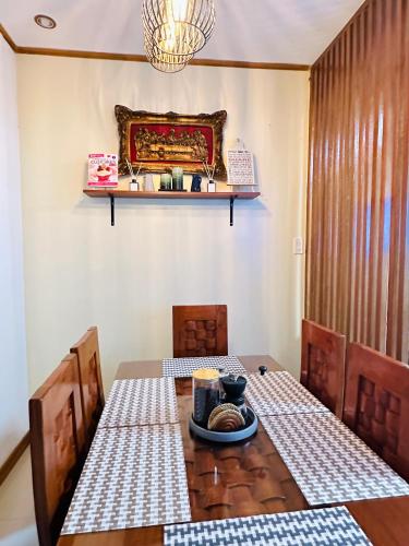 a dining room with a table and a plate of food at Rivero Transient House in San Fernando