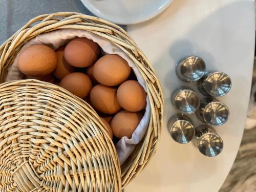 a basket of eggs and spoons on a table at Pal Beach in Palaiochóra
