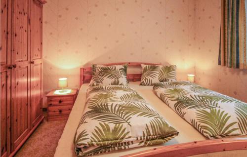 Кровать или кровати в номере Attraktives Ferienhaus Tannhe