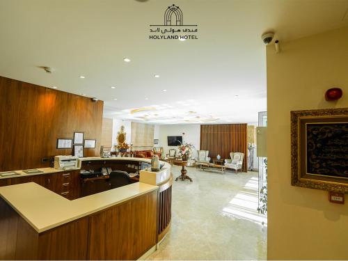 a lobby of a hospital with a waiting room at Holyland Hotel Amman in Amman