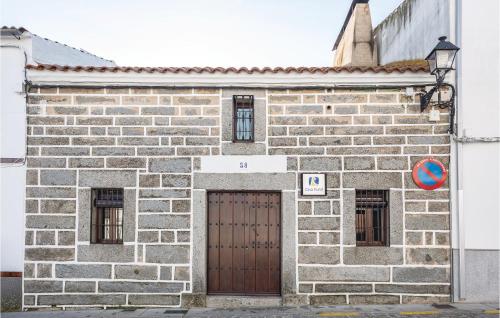 a brick building with a door and two windows at Amazing Home In Añora With Wifi in Anora
