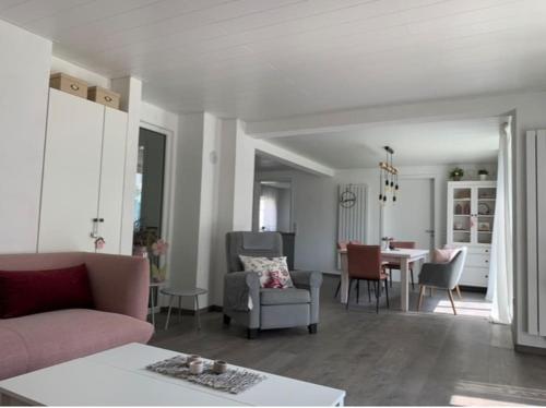 a living room with a couch and chairs and a table at Ferienwohnung König in Schnaittenbach