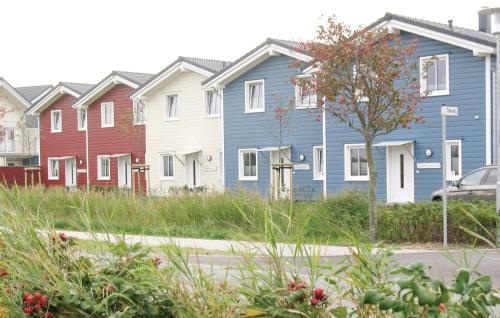 a row of colorful houses in a city at Gorgeous Home In Dagebüll With Sauna in Dagebüll