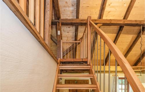 a staircase in a house with wooden ceilings at Kellerstoeckl In Strem in Strem