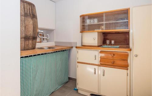 a small kitchen with a sink and a counter at Kellerstoeckl In Strem in Strem
