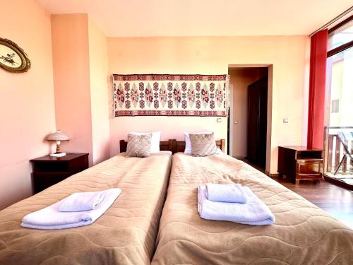 Postel nebo postele na pokoji v ubytování Family Hotel Carpe Diem