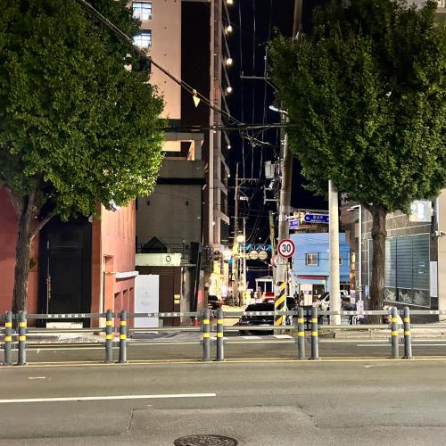 an empty city street at night with at busan&u 2 in Busan