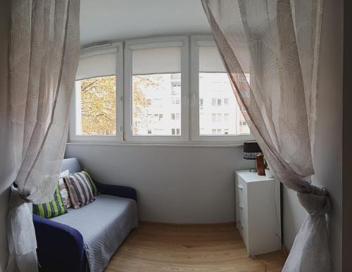 Χώρος καθιστικού στο Przytulny Apartament w Śródmieściu