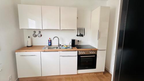 Kuchyň nebo kuchyňský kout v ubytování Modernes Apt im Nordschwarzwald