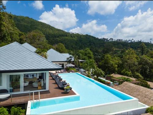 an aerial view of a house with a swimming pool at MM Villa Koh Samui in Amphoe Koh Samui