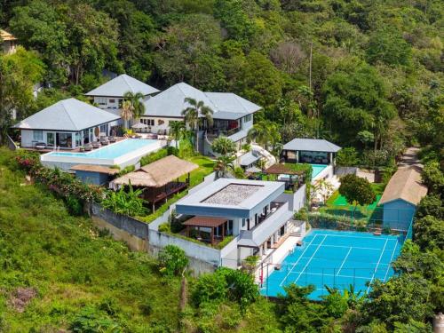 an aerial view of a mansion with a tennis court at MM Villa Koh Samui in Amphoe Koh Samui