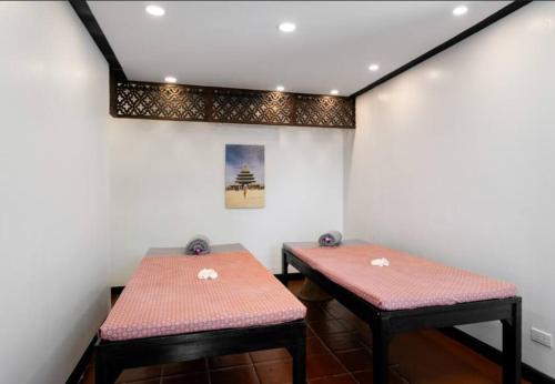 two nesting tables in a room with white walls at MM Villa Koh Samui in Amphoe Koh Samui