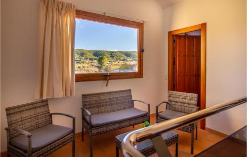 two chairs sitting in a room with a window at Stunning Home In Cehegín in Cehegín
