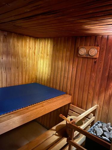 a wooden cabin with a table and a chair in it at Hoch über dem Rheintal in Brigels