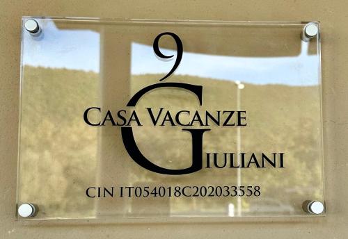 a sign that reads casa yayaannis fulani at Casa vacanze Giuliani via Rasiglia in Casenove