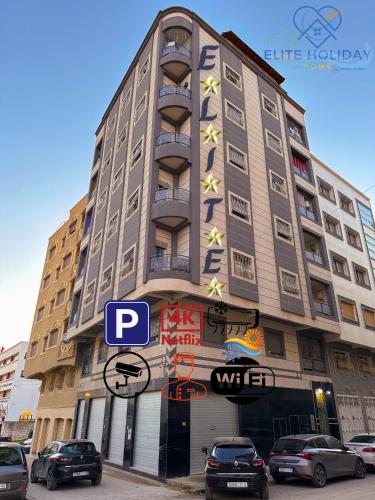 a tall building with a sign on the side of it at Elite Holiday Home - Luxury & Centric Flat in Tangier