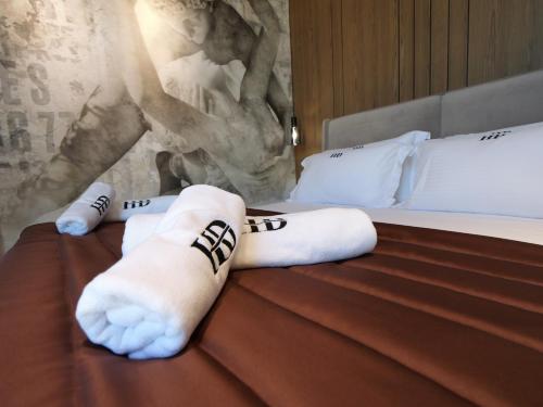 Un ou plusieurs lits dans un hébergement de l'établissement Dial Hotel