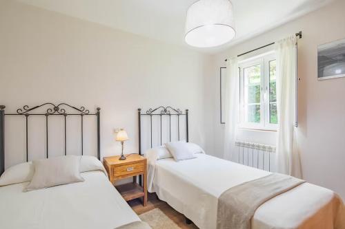 A bed or beds in a room at Casa Playa de Balares