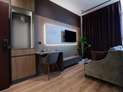 Télévision ou salle de divertissement dans l'établissement Dial Hotel