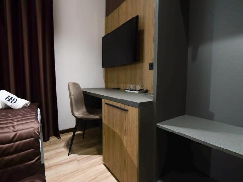 Télévision ou salle de divertissement dans l'établissement Dial Hotel