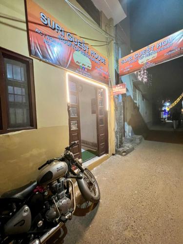 a motorcycle parked in front of a building at Suri Guest House in Pushkar