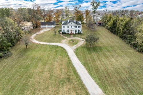 an aerial view of a house with a winding road at Colonial Manor in Spring Hill