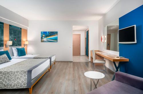 TV a/nebo společenská místnost v ubytování Avena Resort & Spa Hotel
