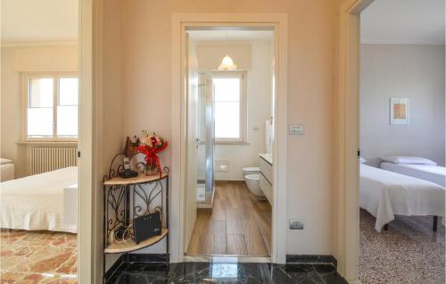 a bedroom with a bed and a bathroom with a mirror at Casa Pra Bene Vagienna in Bene Vagienna