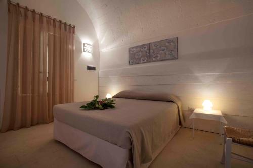 Säng eller sängar i ett rum på Santa Marina Masseria del Salento