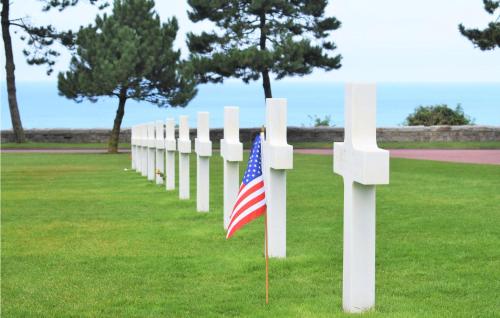 a row of white crosses with an american flag at Awesome Home In Colombieres With Wifi in Colombières
