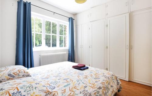 a bedroom with a bed and a window at Awesome Home In Colombieres With Wifi in Colombières