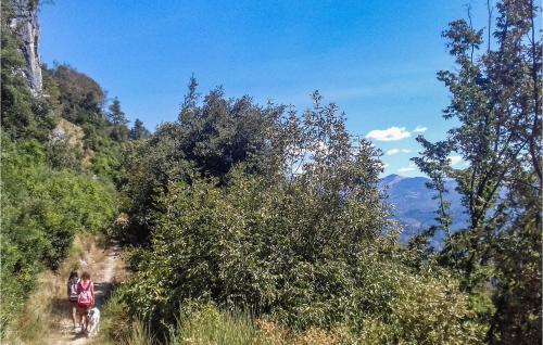 two people walking on a trail in the mountains at Stunning Home In Capannori With Jacuzzi in Capannori