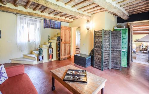 a living room with a couch and a table at Stunning Apartment In Ficulle With Wifi in Ficulle